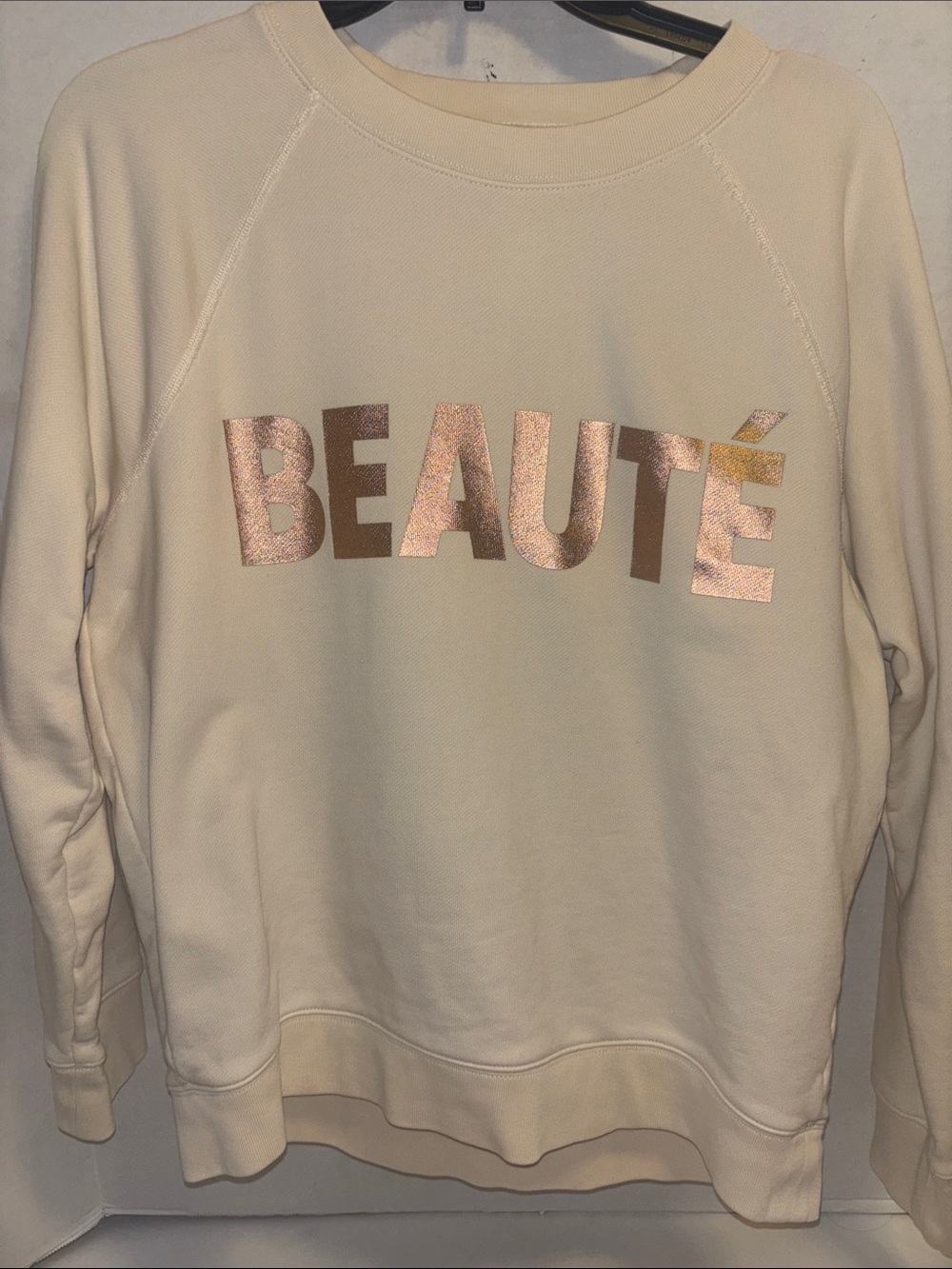 J CREW CREAM COLORED SWEATSHIRT FEATURING METALLIC ROSE GOLD BEAUTE LETTERING